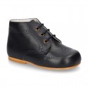 Classic Nappa leather ankle boots to dress with chopped design for first steps.