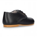 Classic little LACES UP style shoes in nappa leather with scallop.