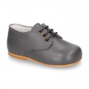 Classic little LACES UP style shoes in nappa leather with scallop.