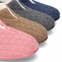 New structured wool knit home shoes with central opening.