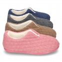 New structured wool knit home shoes with central opening.