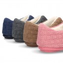 New structured wool knit home shoes with central opening.