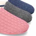 New structured wool knit home shoes with opened shape.