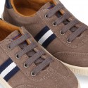 CASUAL Suede leather Tennis with shoelaces and flag detail.