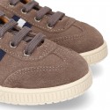 CASUAL Suede leather Tennis with shoelaces and flag detail.