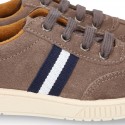 CASUAL Suede leather Tennis with shoelaces and flag detail.