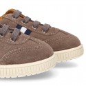 CASUAL Suede leather Tennis with shoelaces and flag detail.