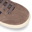 CASUAL Suede leather Tennis with shoelaces and flag detail.