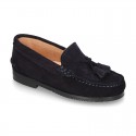 Classic suede leather moccasins with tassels and thick soles.