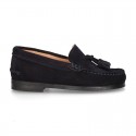 Classic suede leather moccasins with tassels and thick soles.