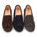 Classic suede leather moccasins with tassels and thick soles.