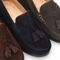 Classic suede leather moccasins with tassels and thick soles.