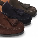 Classic suede leather moccasins with tassels and thick soles.