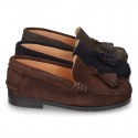 Classic suede leather moccasins with tassels and thick soles.