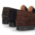 Classic suede leather moccasins with tassels and thick soles.