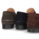 Classic suede leather moccasins with tassels and thick soles.