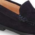 Classic suede leather moccasins with tassels and thick soles.