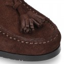 Classic suede leather moccasins with tassels and thick soles.