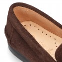 Classic suede leather moccasins with tassels and thick soles.