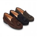 Classic suede leather moccasins with tassels and thick soles.