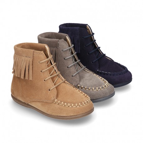 MOHICAN style ankle boots with fringed design in suede leather.