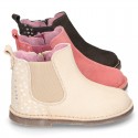 Suede leather ankle boot shoes with HEARTS print design and zipper.