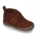 New Casual Suede leather ankle boots with velcro strap and fake hair lining.