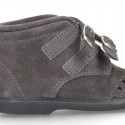 New Classic suede leather little bootie Oxford style with velcro strap and chopped design.
