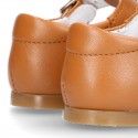 New Classic Nappa Leather T-strap shoes with buckle fastening in cowhide color.