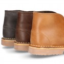 Classic kids Safari boots with faux fur lining in tanned nappa leather.