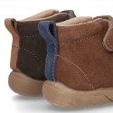 New suede leather ankle boots with elastic shoelaces design, velcro strap and toe cap.