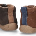 New suede leather ankle boots with elastic shoelaces design, velcro strap and toe cap.