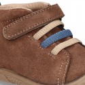 New suede leather ankle boots with elastic shoelaces design, velcro strap and toe cap.