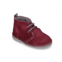 Suede leather kids safari boots with shoelaces and fake hair lining.