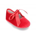 Velvet little Mary Janes for babies with ties closure.