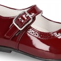 Classic little Mary Janes with chopped design in patent leather.