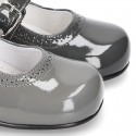Classic little Mary Janes with chopped design in patent leather.