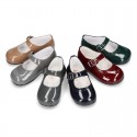 Classic little Mary Janes with chopped design in patent leather.