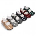 Classic little Mary Janes with chopped design in patent leather.