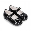Classic BLACK patent leather little Mary Janes with perforated heart design.