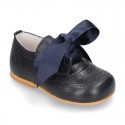 Classic little ENGLISH style shoes with ties in nappa leather.