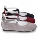 Combined leather little Mary Janes with crossed straps.