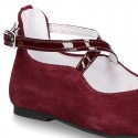 Combined leather little Mary Janes with crossed straps.