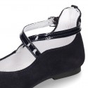 Combined leather little Mary Janes with crossed straps.