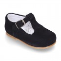 Classic Suede leather T-strap shoes with scallop and buckle fastening.