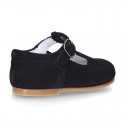 Classic Suede leather T-strap shoes with scallop and buckle fastening.