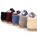 Classic Suede leather T-strap shoes with scallop and buckle fastening.