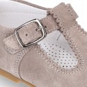 Classic Suede leather T-strap shoes with scallop and buckle fastening.