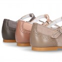 New T-strap little Mary Janes combined in soft suede leather with soft nappa leather.