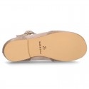 New T-strap little Mary Janes combined in soft suede leather with soft nappa leather.